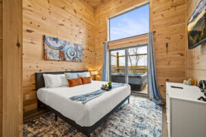 Step into luxury as our second bedroom opens onto a private deck featuring a soothing hot tub