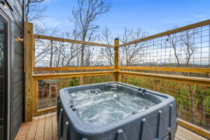 Indulge in luxury  where a  hot tub awaits with a panoramic view