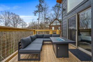 Experience outdoor luxury with our inviting sofa and a central propane fire table