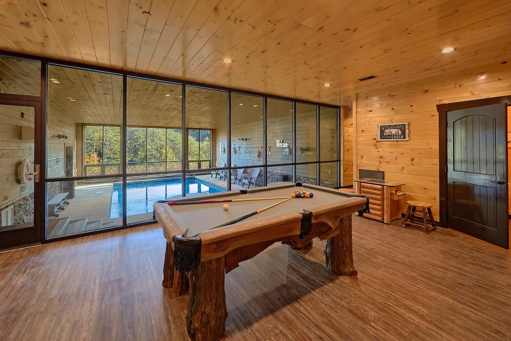 pool table and indoor pool in cabin