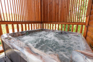 The hot tub is a great place to relax and soak in the gorgeous mountain views