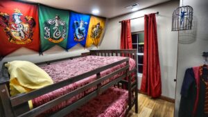 Wizard Houses bedroom with queen over queen bunks