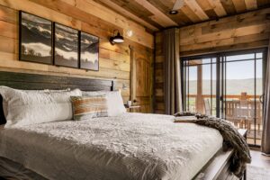 Main level King bedroom with a view. As with all bdrms, it has a pvt bathroom.