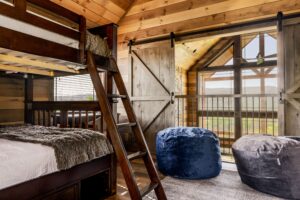 Queen over Queen adult sized bunk bed room on the upper level. Private bathroom.