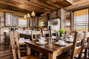 Our 8-persons dining table with our kitchen beyond.